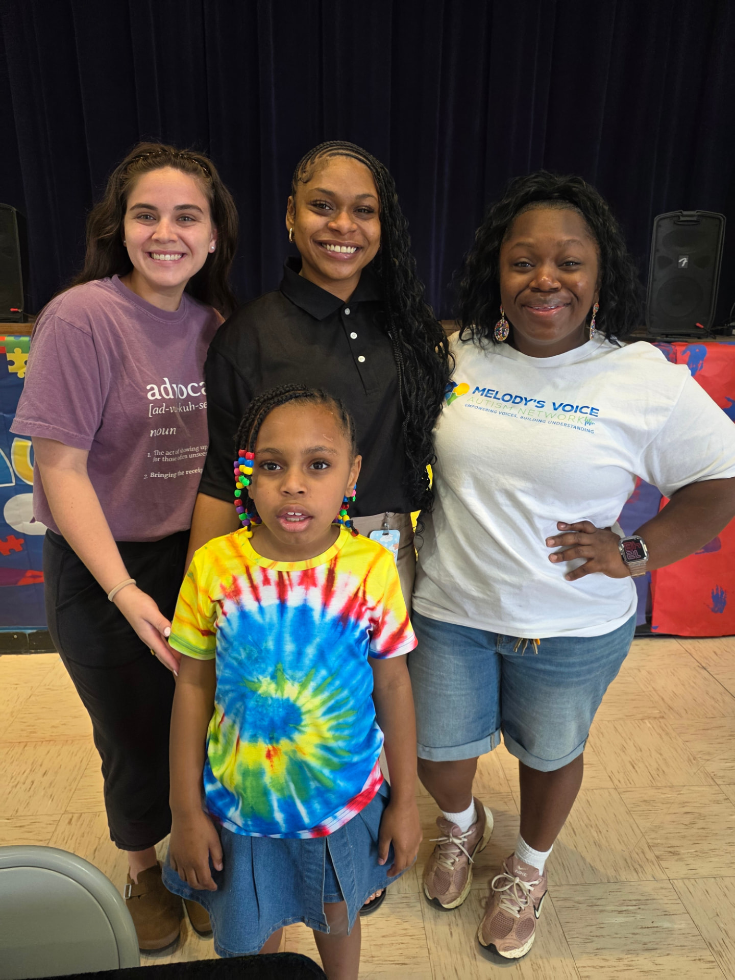 Melody with her family at a Melody's Voice Autism Network community event